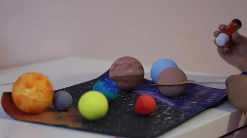 Close up view of astronomy objects on a list of paper. Home education. Stock Footage 165736372