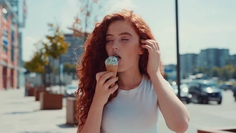 Close up view of attractive redheaded curly Caucasian teenage girl outdoors Stock Footage 114248762