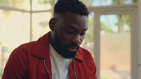 Close up view of attractive young Afro-American man withdrawing cash Stock Footage 111220574