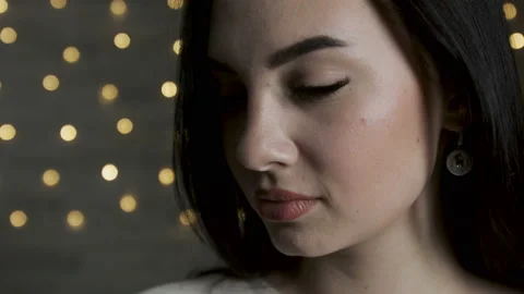 Close up view of attractive young girl posing in front of camera. lights  Video stock 106985478