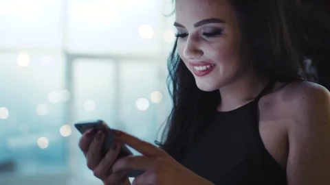 Close up view of attractive young woman in a stylish black top surfing the net Stock Footage 74901853
