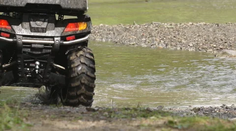 Close Up View Of Atv Wheels In river Stock Footage 40545164