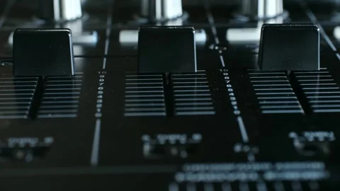 Close-up view of audio mixer controls showcasing smooth transitions of faders Video stock 317905165
