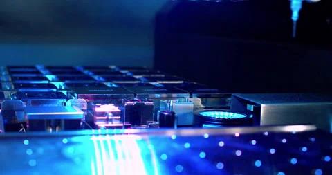 A close up view of automated machinery inserting components Stock Footage 332852696