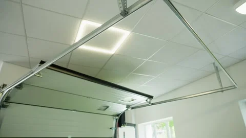 Close up view of an automatic garage door lifting smoothly Stock Footage 316231116