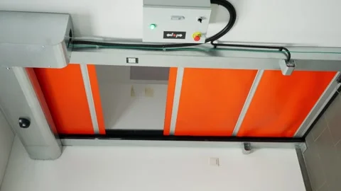 Close up view of automatic industrial doors opening by motion detection system Video stock 325569798