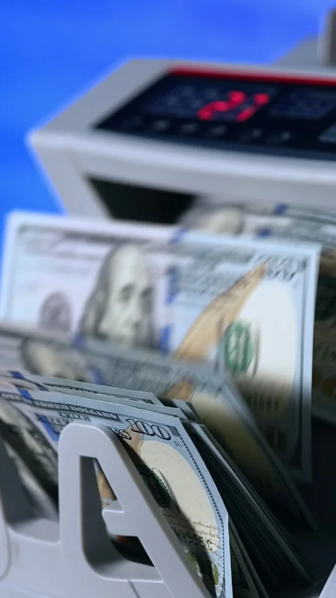 A close-up view of automatic money counting machine quickly processing and .. Stock Footage 337543041