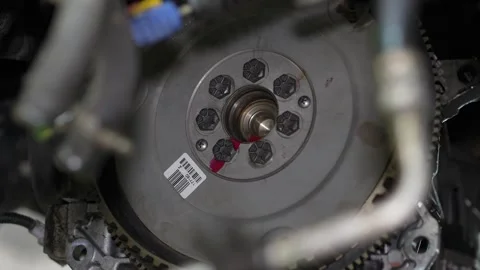 Close-up view of automotive engine component with bolted assembly Stock Footage 347302725