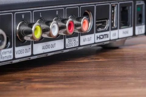 Close up view of the back panel ports of a multimedia device on a wooden surf Stock Photos