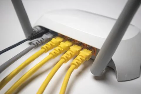 Close-up view of the back panel of a white wireless router with multiple ye.. Stock Photos