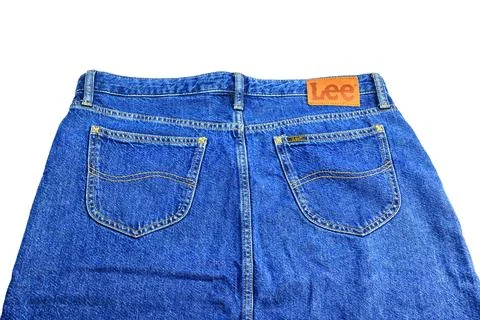 Close up view of back view of blue Lee denim skirt with leather brand patch, Stock Photos