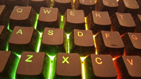 Close up view of a backlit mechanical computer keyboard keys Stock Photos