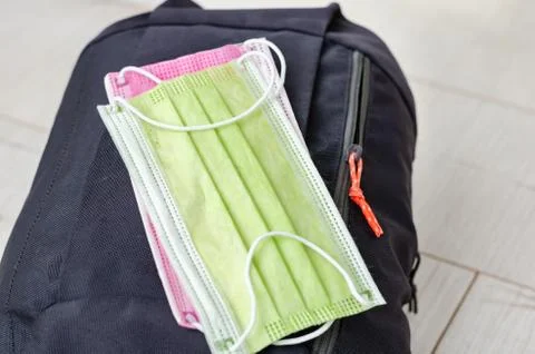 Close up view with a backpack with   face protection mask ready for the mount Stock Photos
