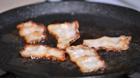 Close-up view of bacon slices in frying pan. time-lapse Stock Footage 171401371