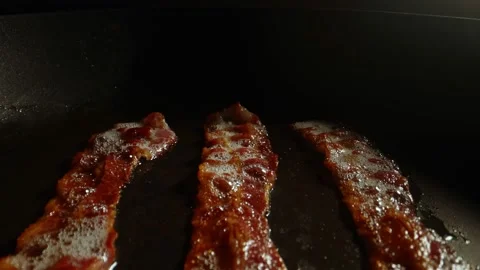 Close-up view of bacon slices in frying pan. Stock Footage 194499037