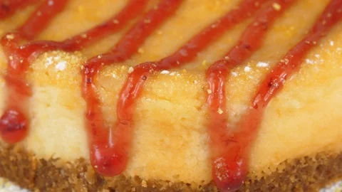 Close-up view of Baked Cheese cake with strawberry jam, served in Restaurant Stock-Footage 95342861