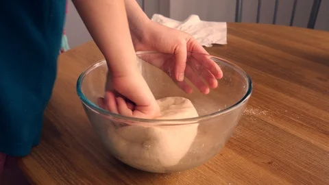 Close up view of baker kneading dough in flour on plate.Manufacturing process, w Stock Footage 125510339