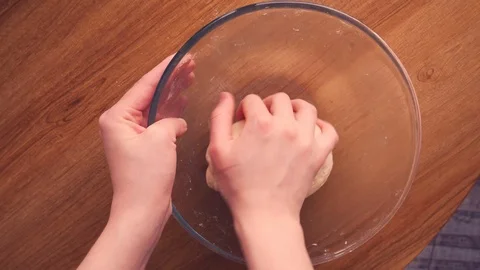 Close up view of baker kneading dough in flour on plate.Manufacturing process, w Stock-Footage 125510346
