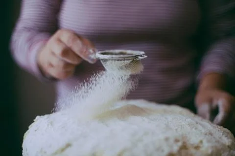 Close up view of baker kneading dough. Homemade bread. Hands preparing bread  Stock Photos