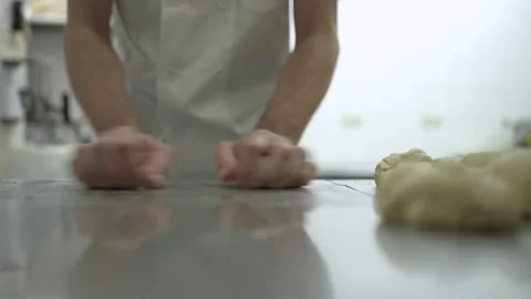 Close-up view of baker shaping dough pieces into bread rolls 2 스톡 동영상 251345127