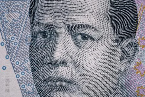 A close view of a banknote shows a person's face and intricate designs Stock Illustration