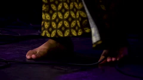 Close up view of bare feet of traditional Javanese dancer in batik sarong p.. Stock Footage 344798998