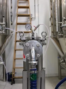Close up view of a barometer connected to beer cylinders at a brewery Stock Photos