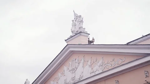 Close view of bas-relief and sculptures on the roof of a public building in the Stock Footage 139784447