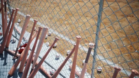 Close-Up View of Baseball Equipment Against A Chain Link Fence 스톡 동영상 202189810