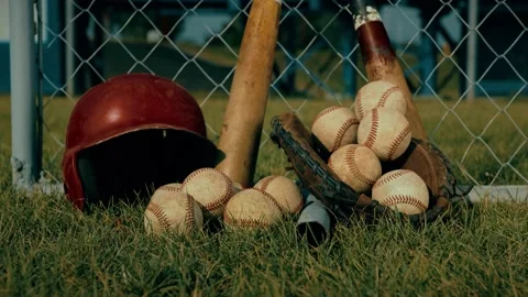 Close-Up View of Baseball Equipment on Grassy Baseball Field Stock-Footage 202149606