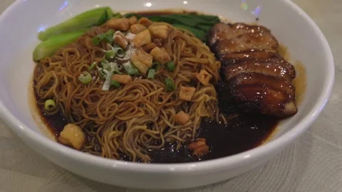 Close-up view of the bbq pork wanton noodle with crackling 動画素材 248525580