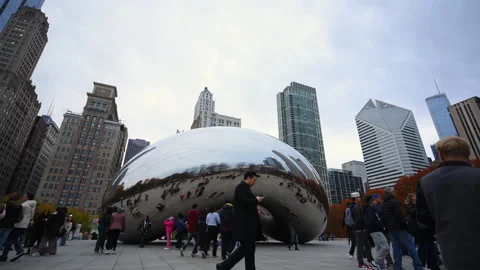 Close up view of the Bean Cloud Gate in winter Chicago with a modern city high Stock Footage 321716034