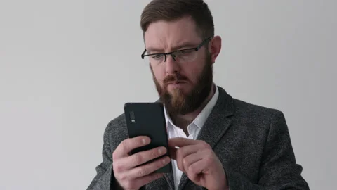 Close up view of bearded middle aged man using phone Video stock 180396770