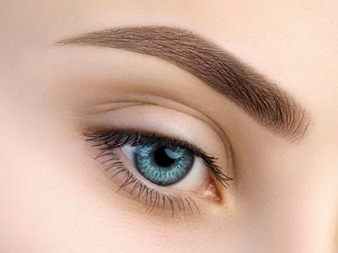 Close up view of beautiful blue female eye Stock Photos
