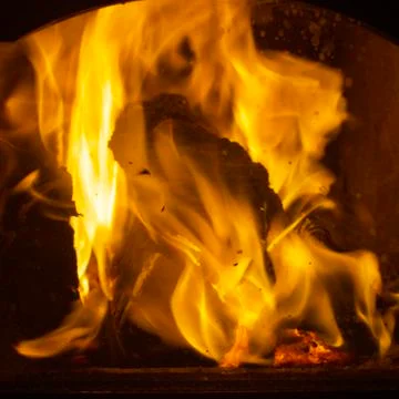 A close-up view of the Beautiful Burning Fire in the home fireplace Stock Photos