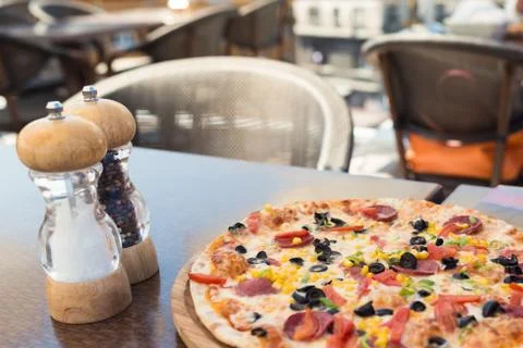 Close-up view of beautiful dish ready to eat. Pizza on the table Stock Photos