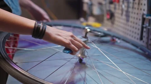 Close-up view of beautiful hands of skillful hard-working female mechanic fixing Stock Footage 232868688
