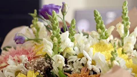 Close up view of beautiful multi-colored bouquet in purple white and yellow Stock Footage 229763070