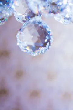 Close up view of beautiful round shape crystal chandelier hanging from ceilin Stock Photos