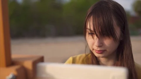 Close up view of beautiful woman's painter face. Creative person at work Stock Footage 76747451