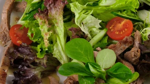 Close-up view of Beef salad with fresh vegetables Stock Footage 78188175