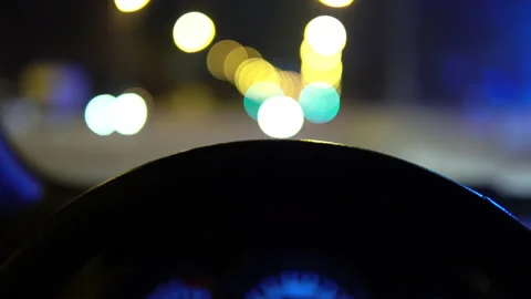 Close-up view from behind the wheel of a car, cars drive behind the windshield Stock Footage 146407928