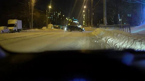 Close-up view from behind the wheel of a car, cars drive behind the windshield Stock Footage 146411181