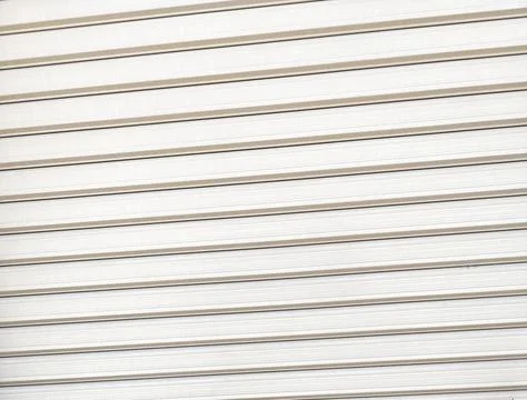 Close up view of beige horizontal shutter panels with subtle texture and line Фото