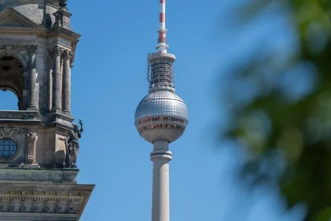 Close View of Berlin TV Tower Beside Cathedral Stonework Stock Photos