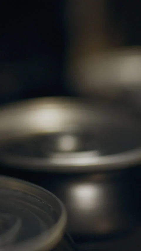 Close-up view of beverage cans on a dark surface revealing details of the pu Stock Footage 331533935