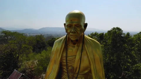 Close view of a big monk statue close to highway in Chiang Mai, Lampang Road Stock Footage 238628575