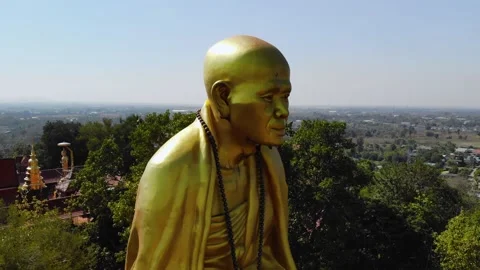 Close view of a big monk statue close to highway in Chiang Mai, Lampang Road Stock Footage 238628599