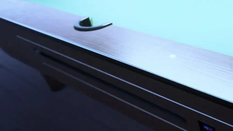 Close up view of a billiards table pocket in a game room Stock Footage 343539611