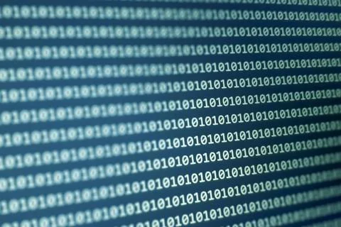 Close-up view of binary code displayed on a digital screen, representing data Foto stock